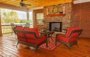 Brick fireplace in wooden home patio area